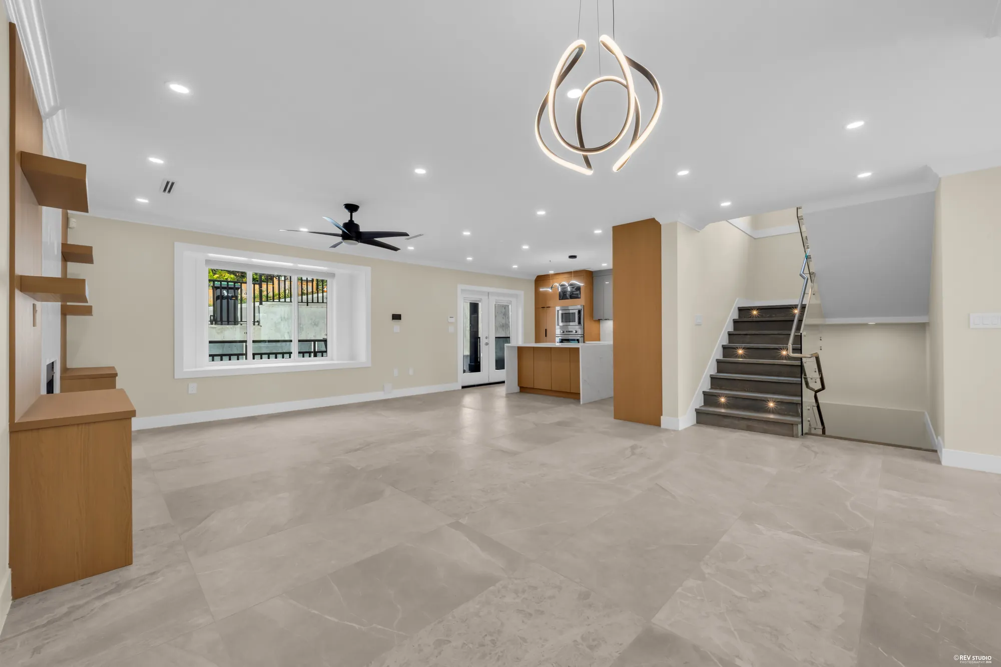 The family room toward the stair, a pendant over the dining area