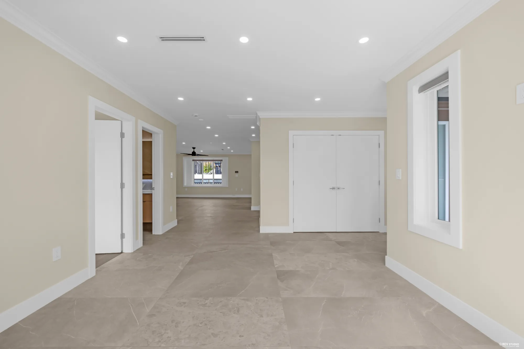 The living room toward the kitchen and the family room beyond