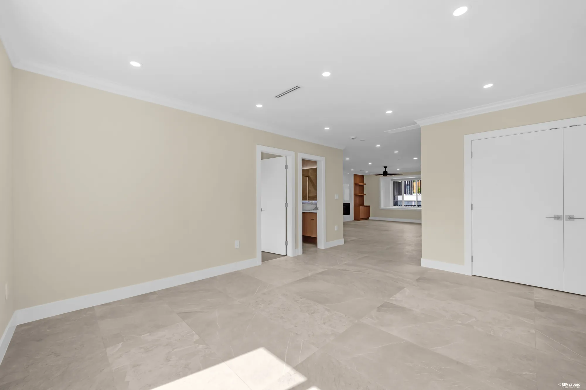 The living room toward the foyer and the front door
