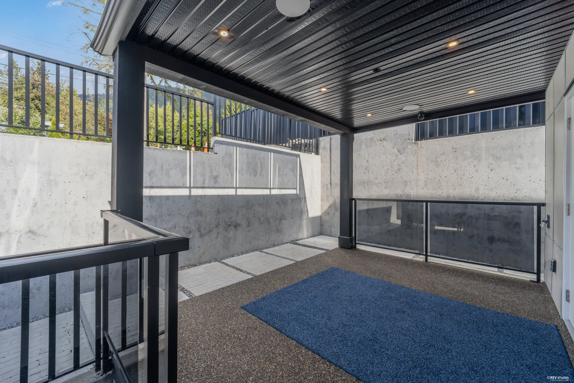 The covered patio toward the stair up to the deck